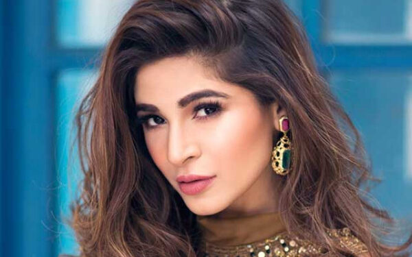 At what age did Ayesha Omar enter the world of showbiz?