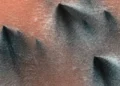 What are these dark spots on the southern side of Mars?