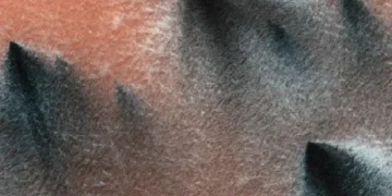 What are these dark spots on the southern side of Mars?