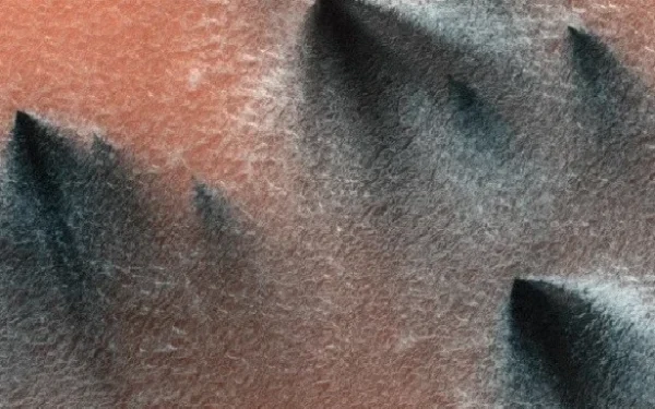 What are these dark spots on the southern side of Mars?