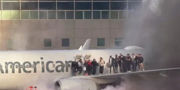 A plane full of passengers caught fire at a US airport, video goes viral